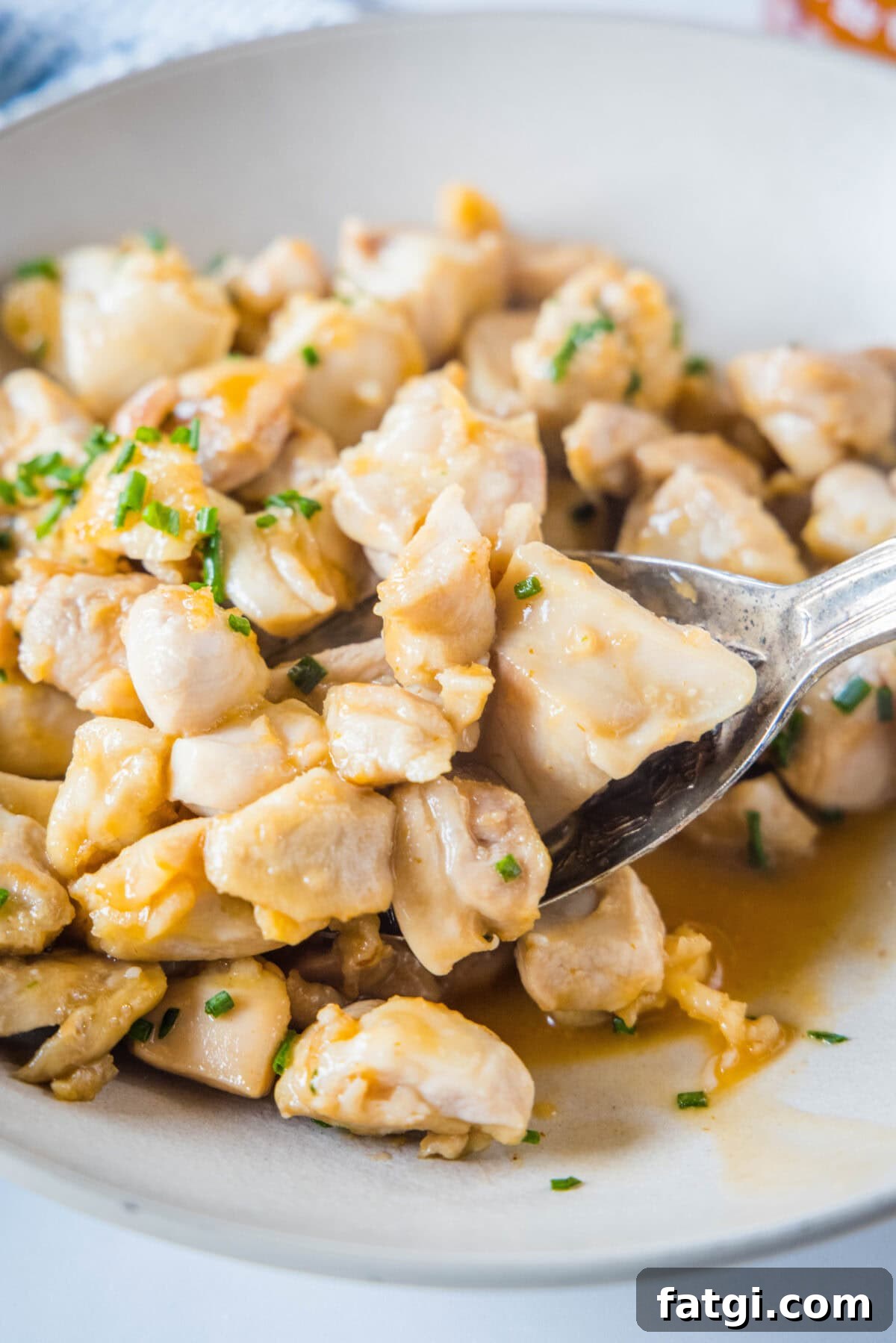 Crispy Honey Sriracha Chicken Bites 5 spooning chicken bites out of a bowl