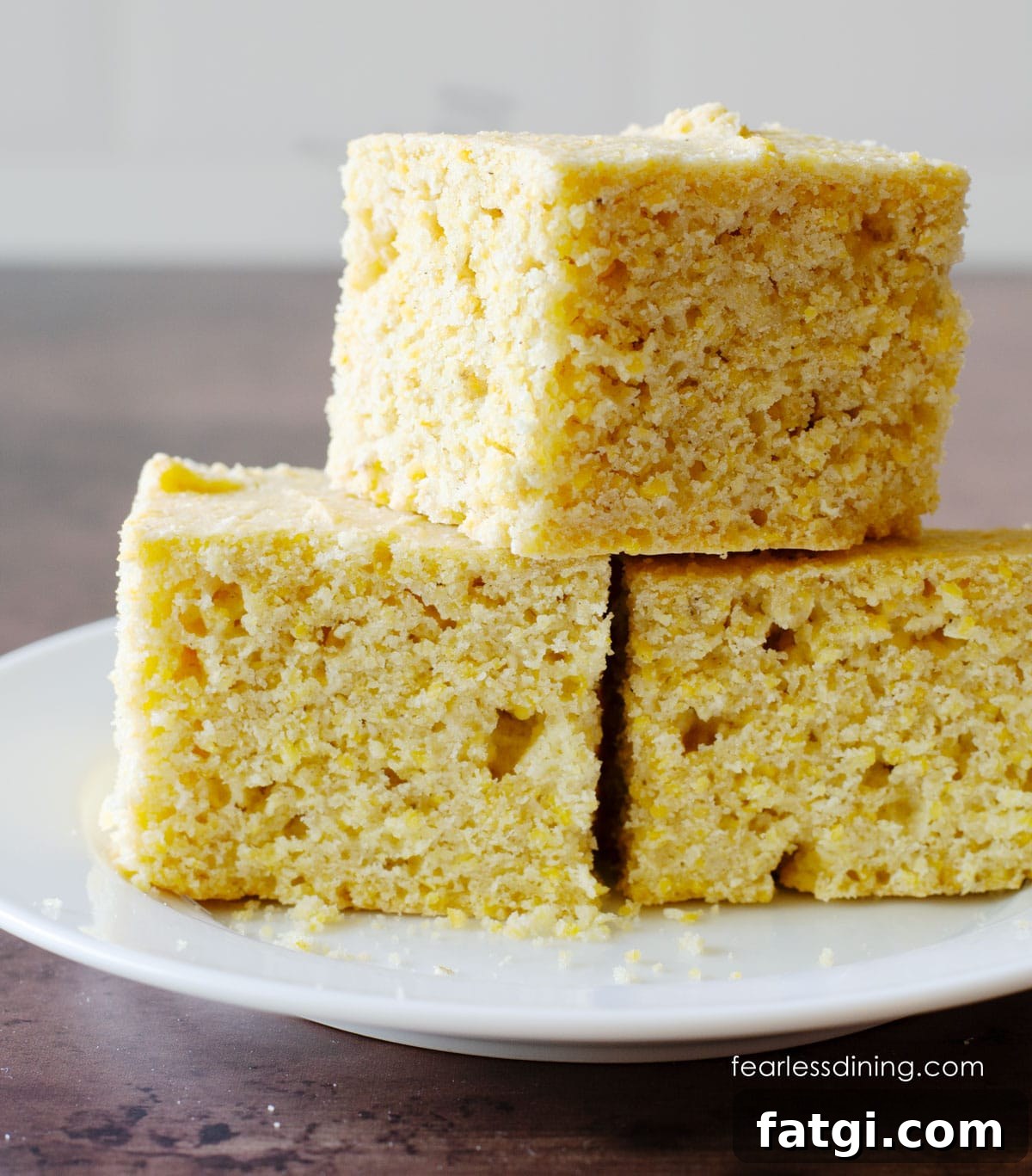 A stack of three pieces of gluten-free sourdough cornbread.