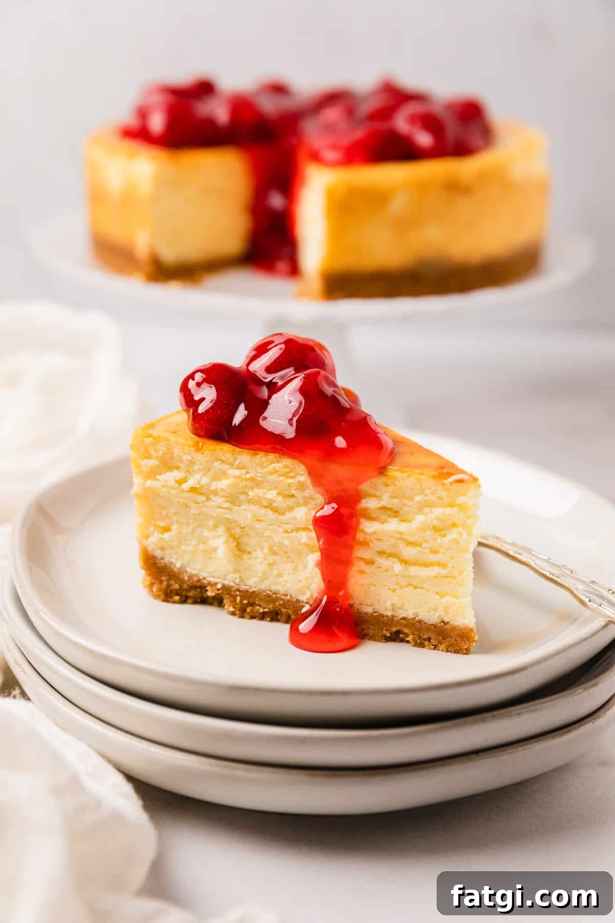the complete air fryer cheesecake topped with strawberry sauce