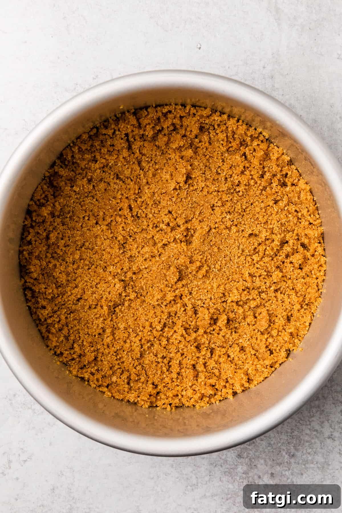 graham cracker crumbs in a springform pan