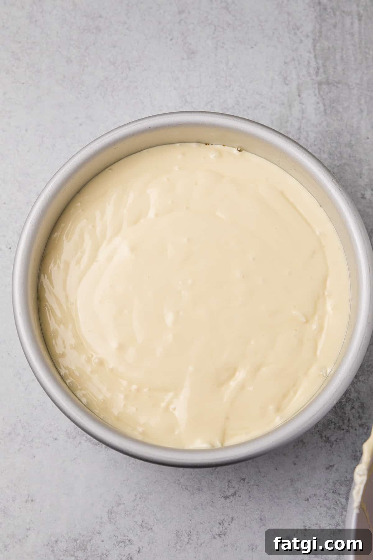 cheesecake batter in prepared pan
