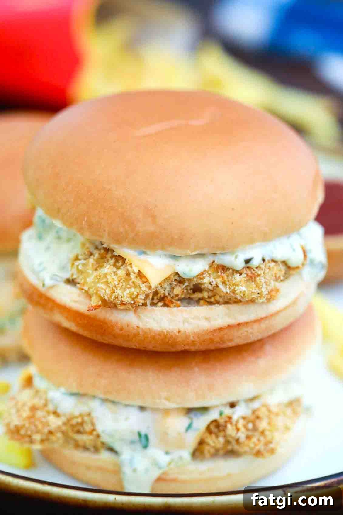 Copycat McDonald's Filet-O-Fish Sandwich Recipe 8 Homemade McDonald's fish sandwich on top of another sandwich