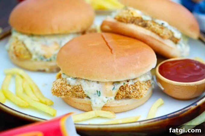 Copycat McDonald's Filet-O-Fish Sandwich Recipe 6 McDonald's filet-o-fish on a plate with fries and ketchup