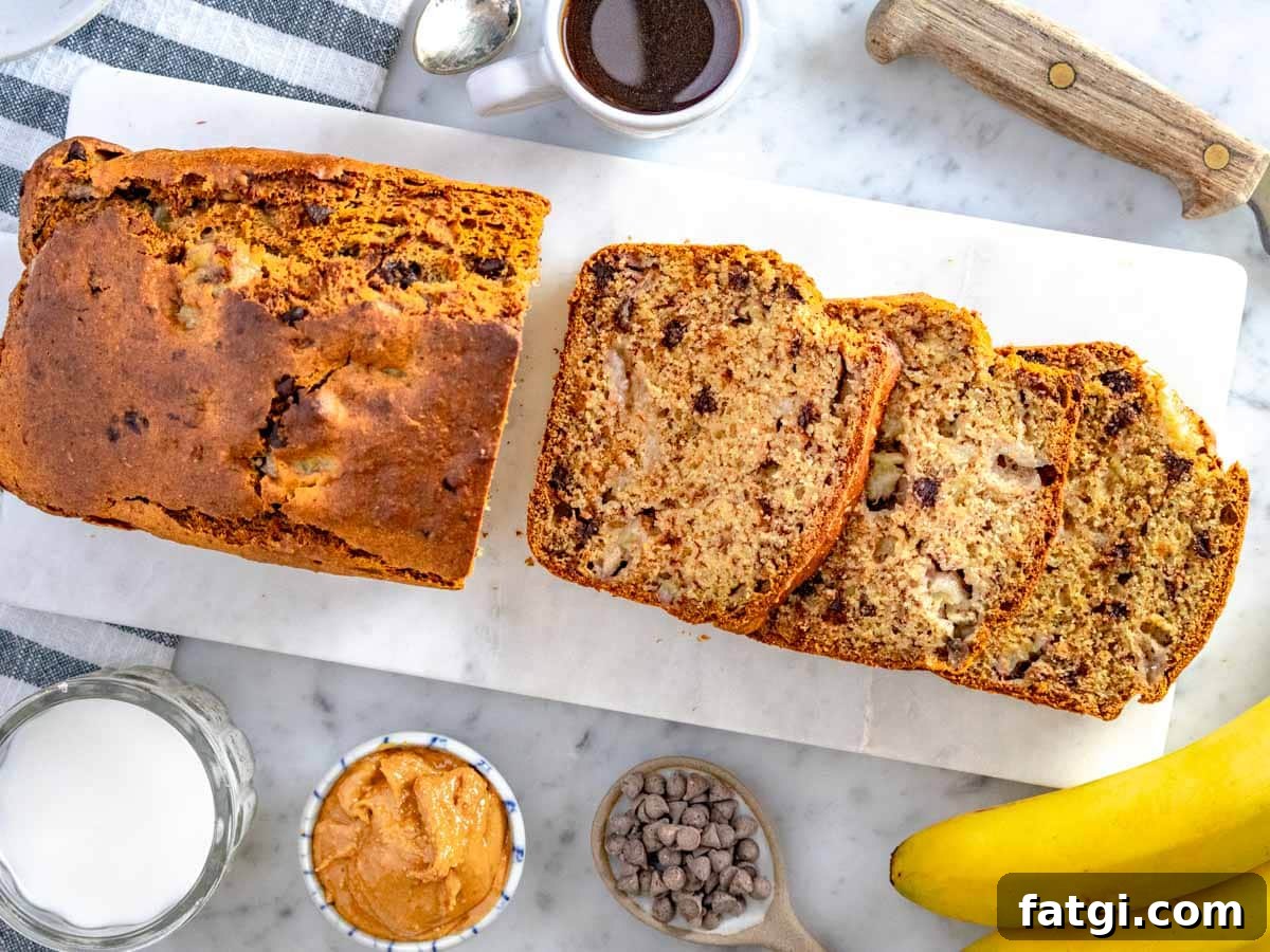 healthy banana bread sliced on a marble cutting board