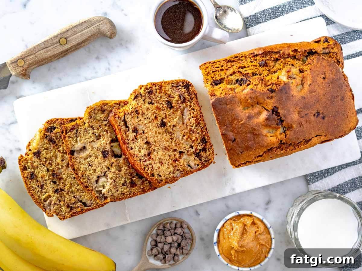 slices and loaf of healthy banana bread served with coffee and peanut butter