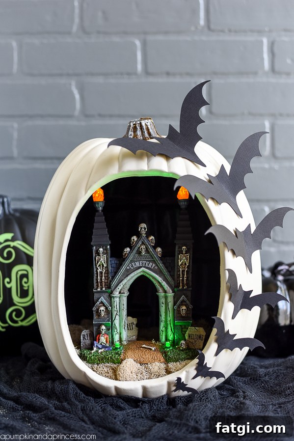 DIY Pumpkin Diorama - create a spooky graveyard entrance pumpkin diorama with flying bats.