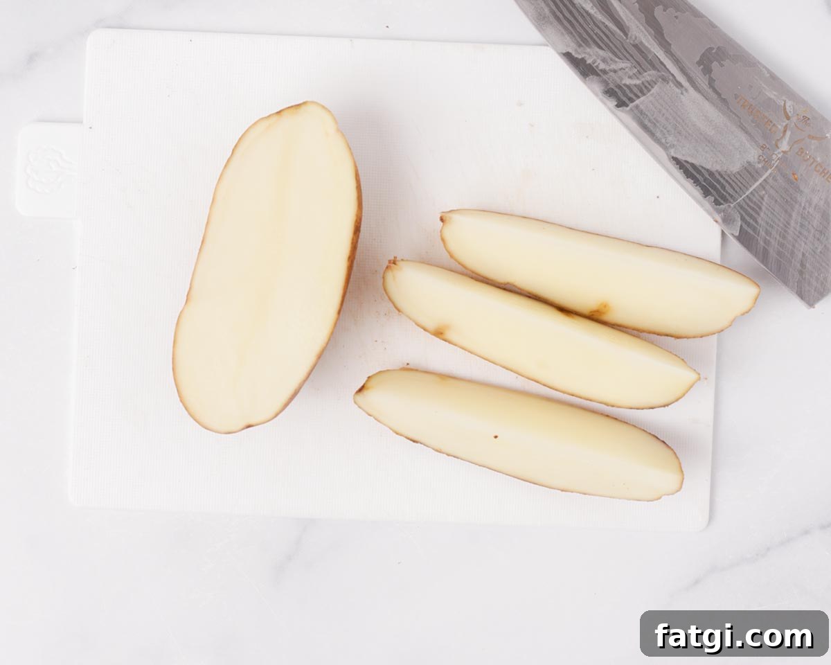 Crispy Air Fryer Potato Wedges 5 Cutting potato into wedges.