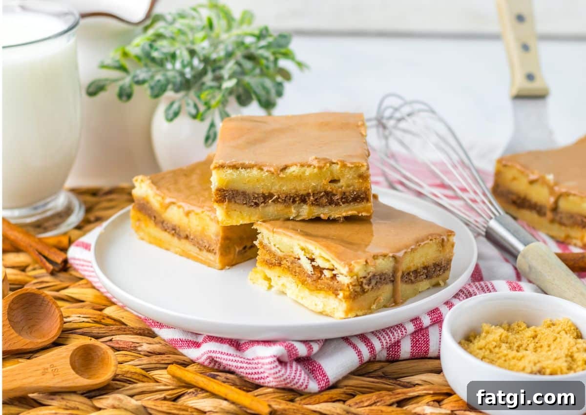 Three brown butter cinnamon bars on a small plate.