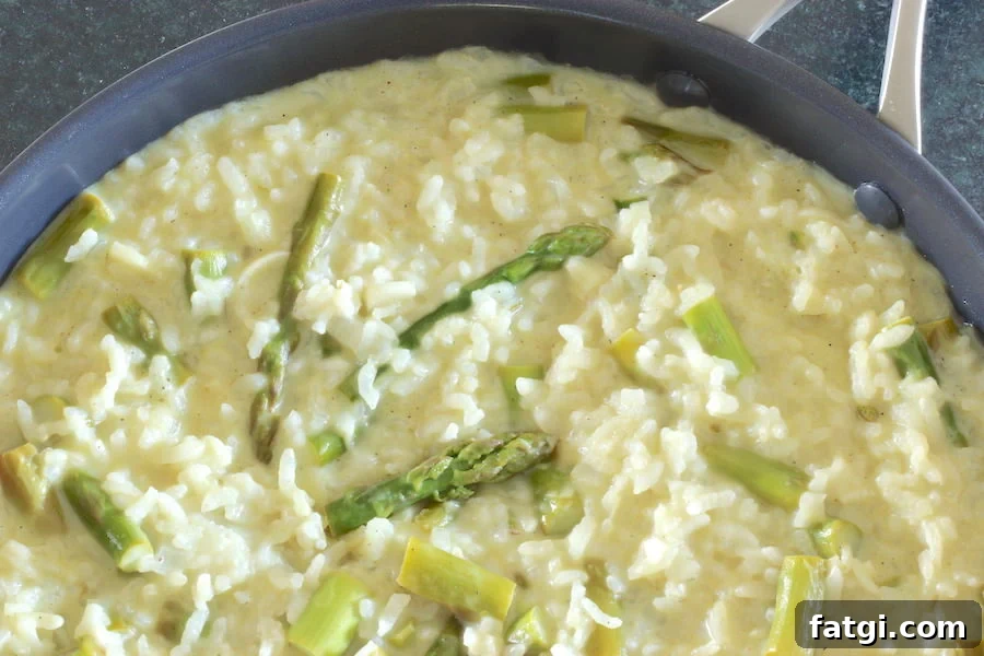 Creamy Vegan Asparagus Risotto Recipe with Garlic and Lemon 2 Asparagus risotto cooked in a large skillet