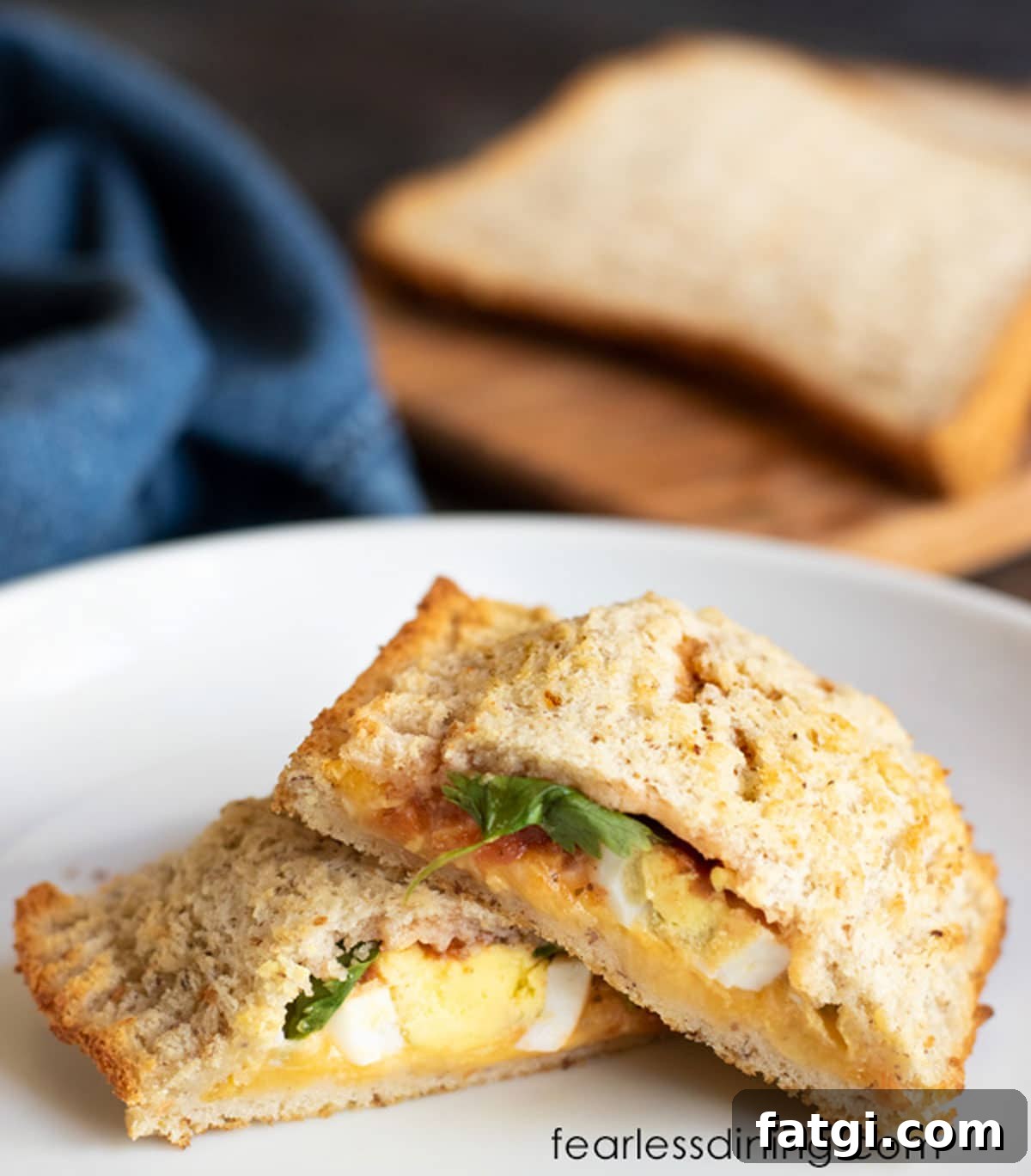 A gluten free hot pocket cut in half so you can see the fillings.