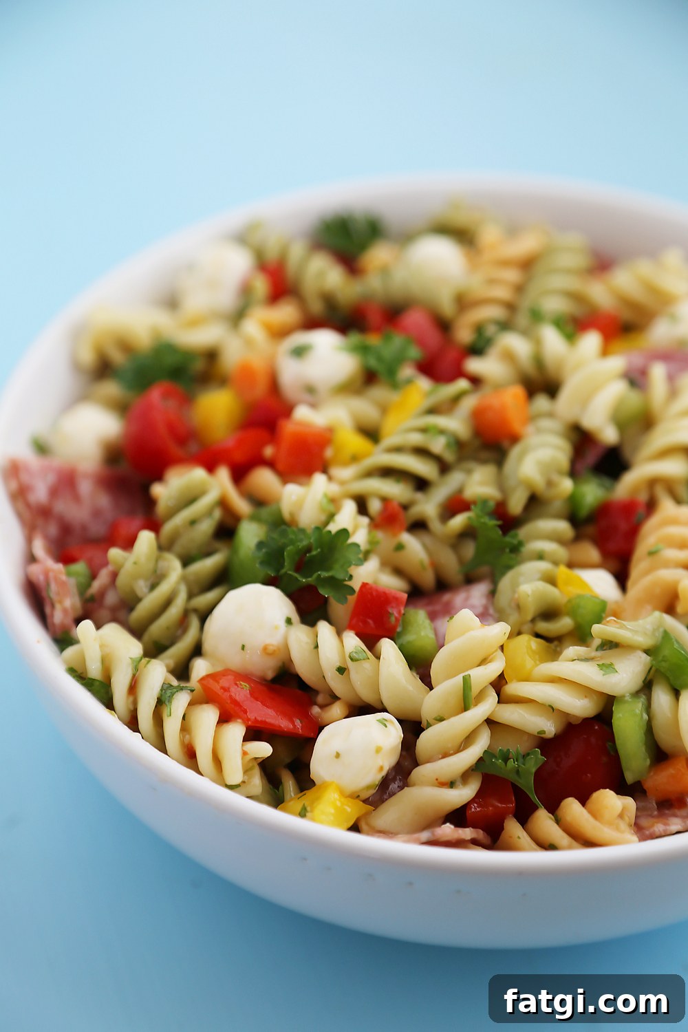 Italian Pasta Salad with Salami and Mozzarella 3 Italian Pasta Salad – So colorful and flavorful, and EASY! Perfect for parties, potlucks and simple weeknight sides. Thecomfortofcooking.com