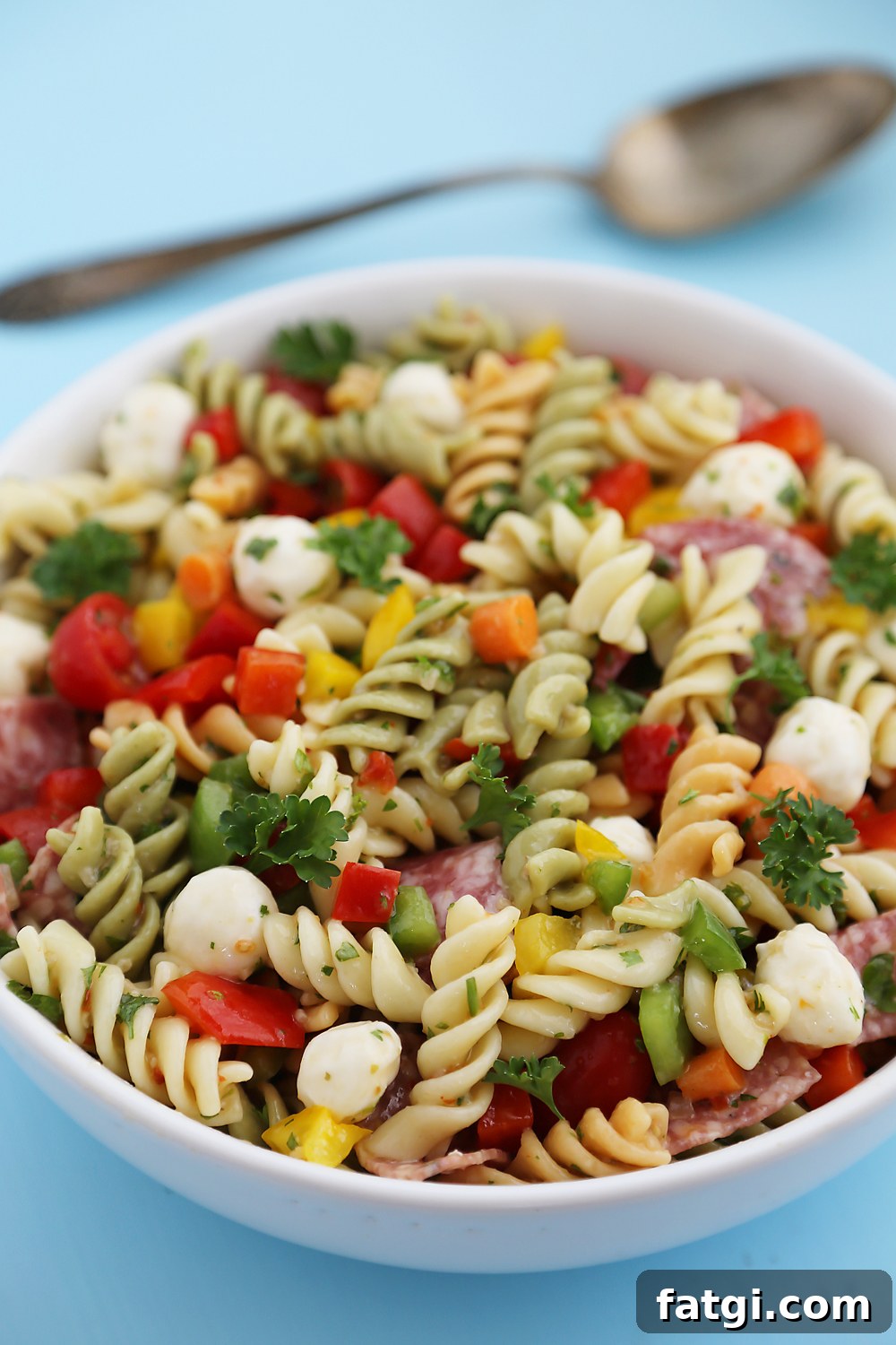Italian Pasta Salad with Salami and Mozzarella 4 Italian Pasta Salad – So colorful and flavorful, and EASY! Perfect for parties, potlucks and simple weeknight sides. Thecomfortofcooking.com