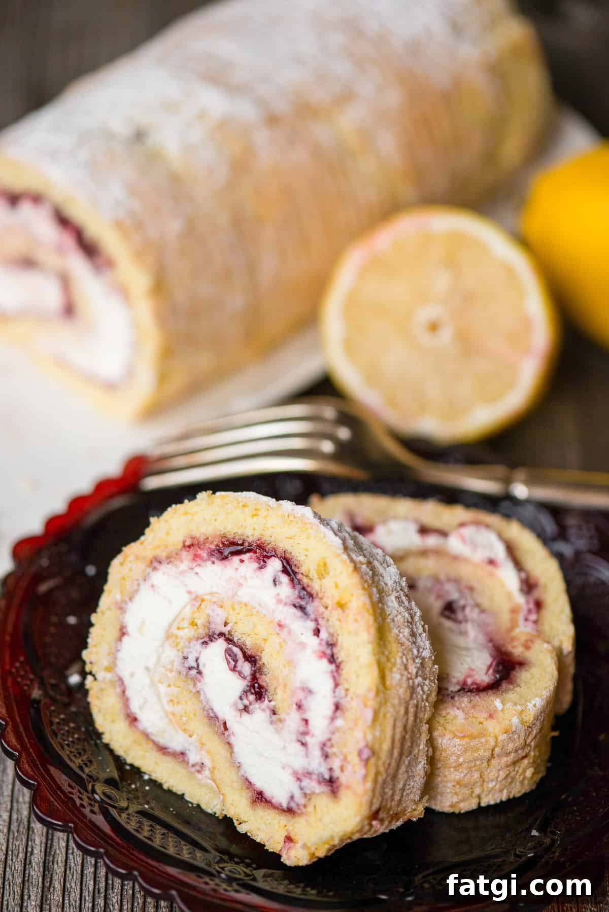 slices of lemon berry cake roll with cream filling.