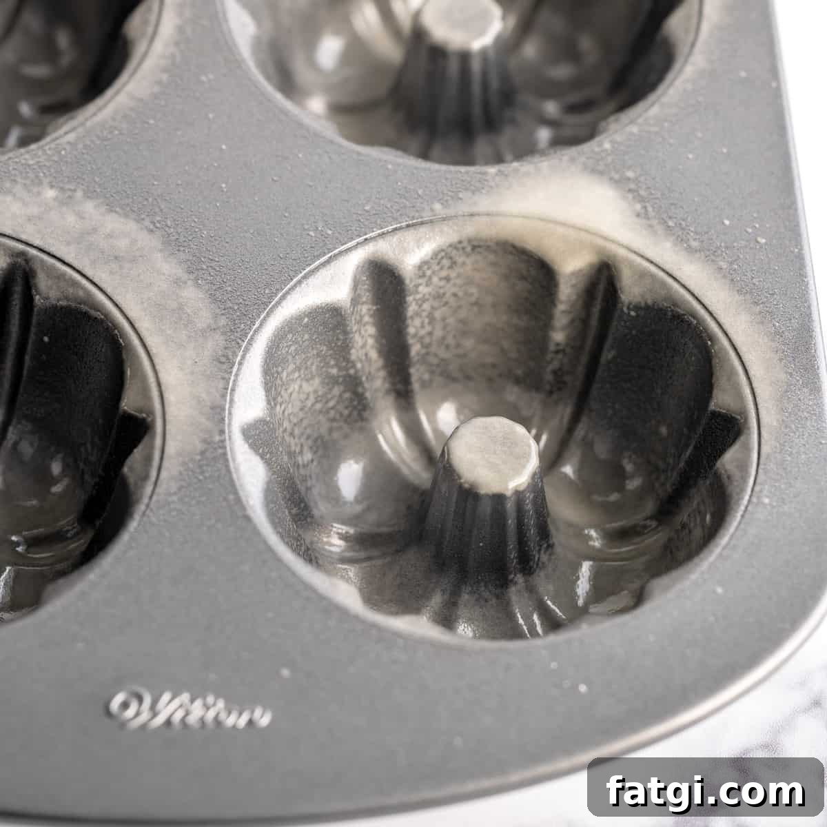 A mini bundt pan sprayed with cooking spray