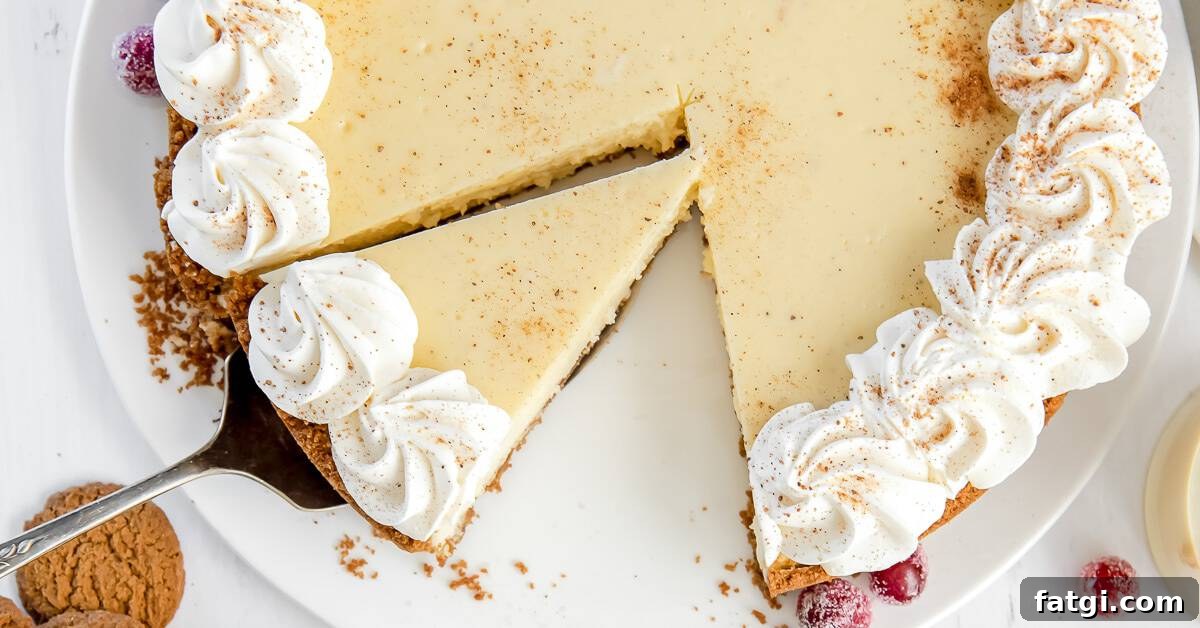 Close up of a cheesecake topped with whipped cream being served.