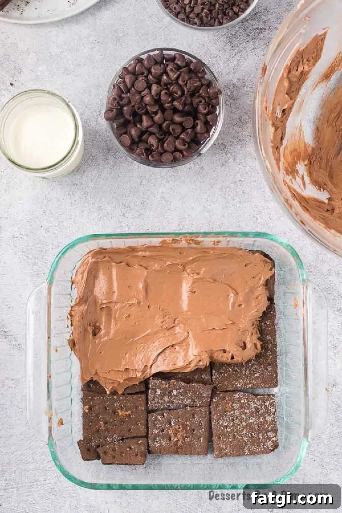 Chocolate mixture spread on graham crackers. 