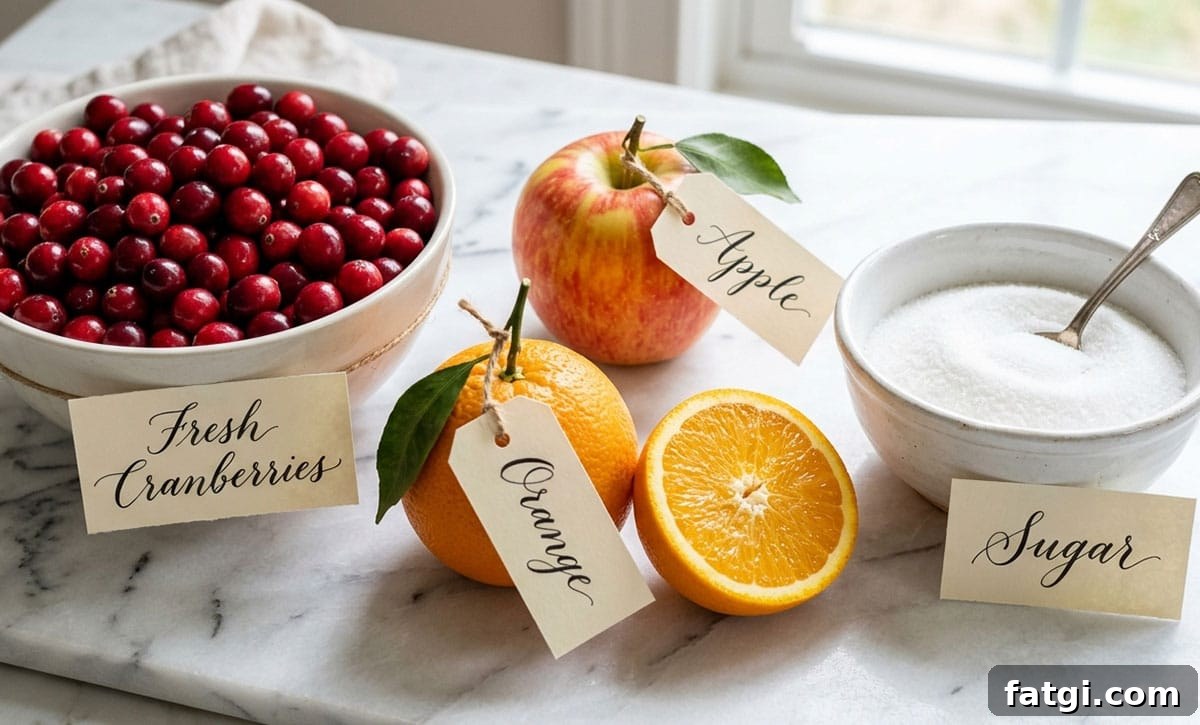 Ingredients for cranberry relish on a white marble background.
