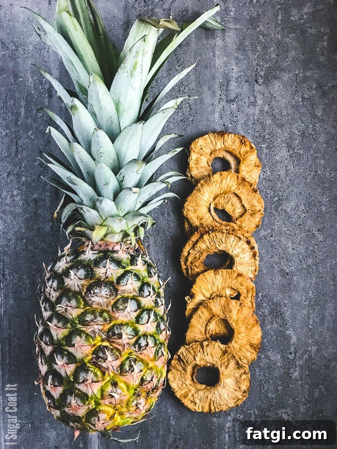 Spicy Pina Colada Dark Chocolate Bar with coconut rum-soaked dehydrated and freeze-dried pineapple, shaved coconut and Aleppo flakes on dark chocolate.