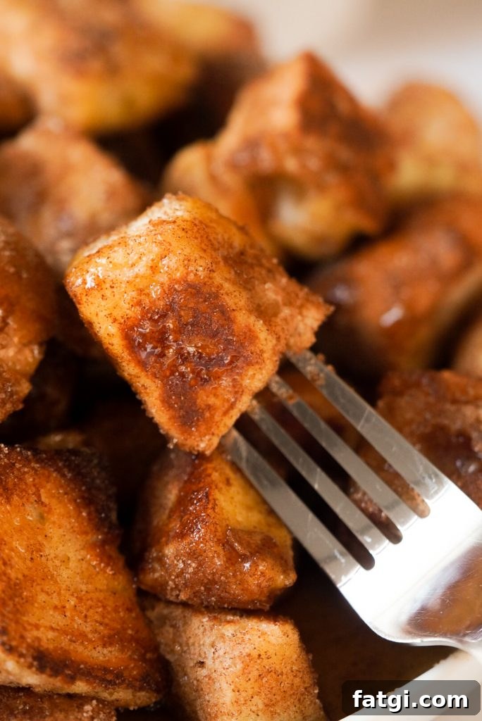 fork taking a small french toast cube