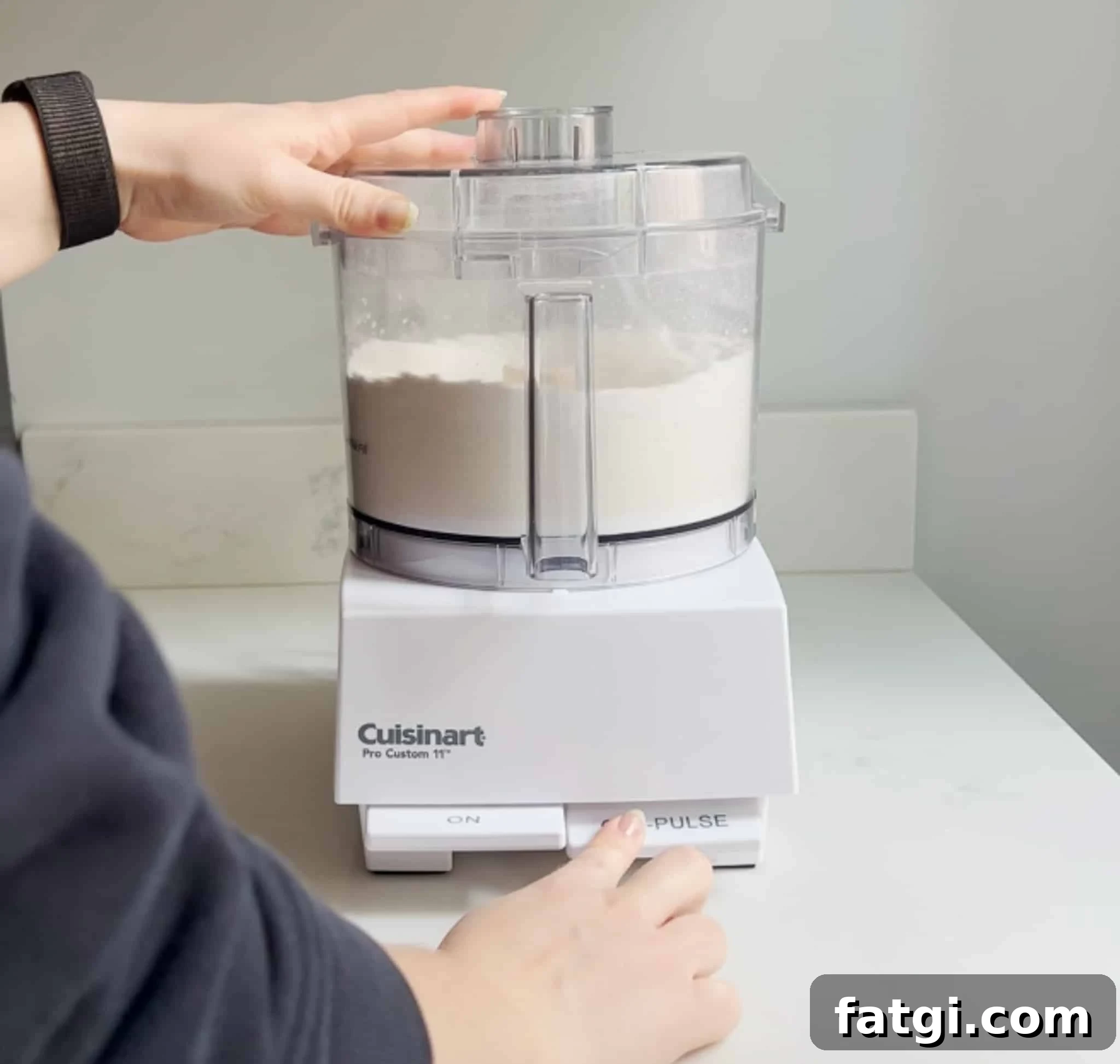 Mixing together dry ingredients in a food processor.