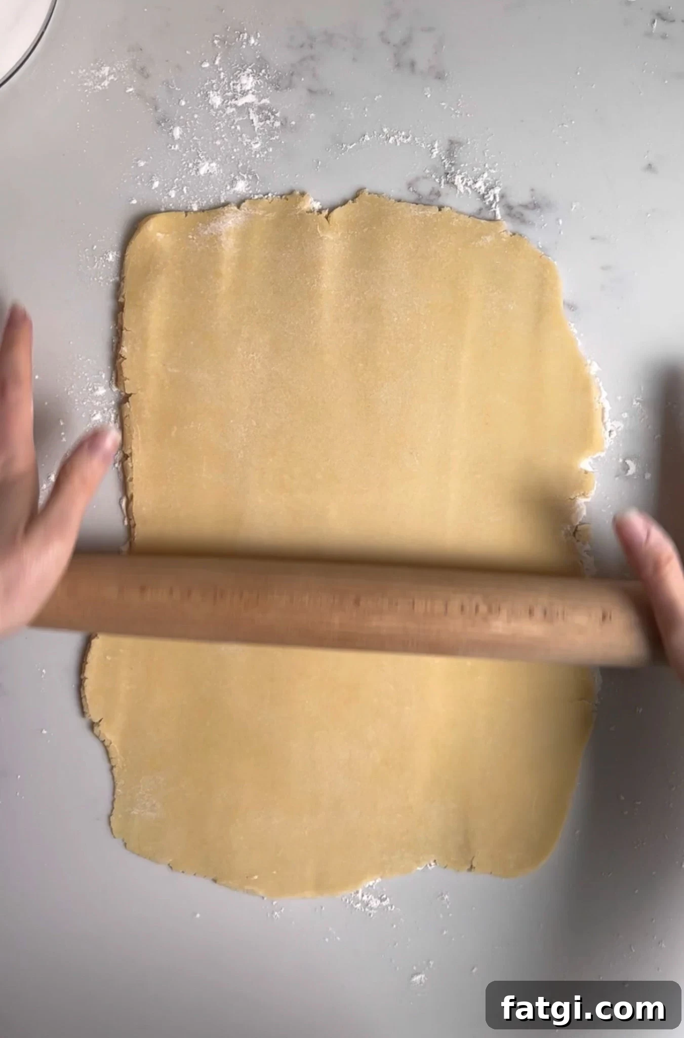 Rolling out pastry dough.
