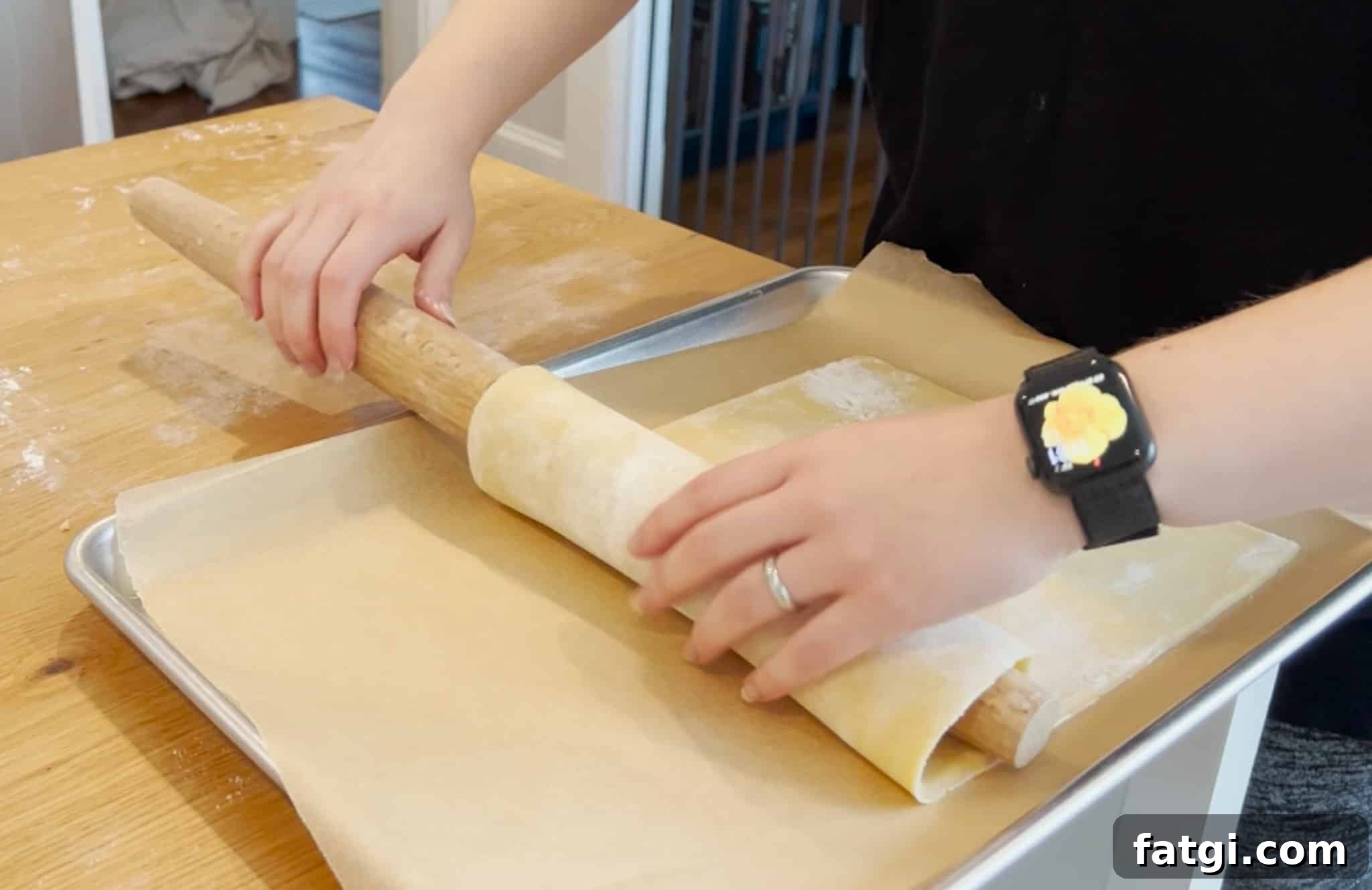 Transferring dough to a baking sheet.