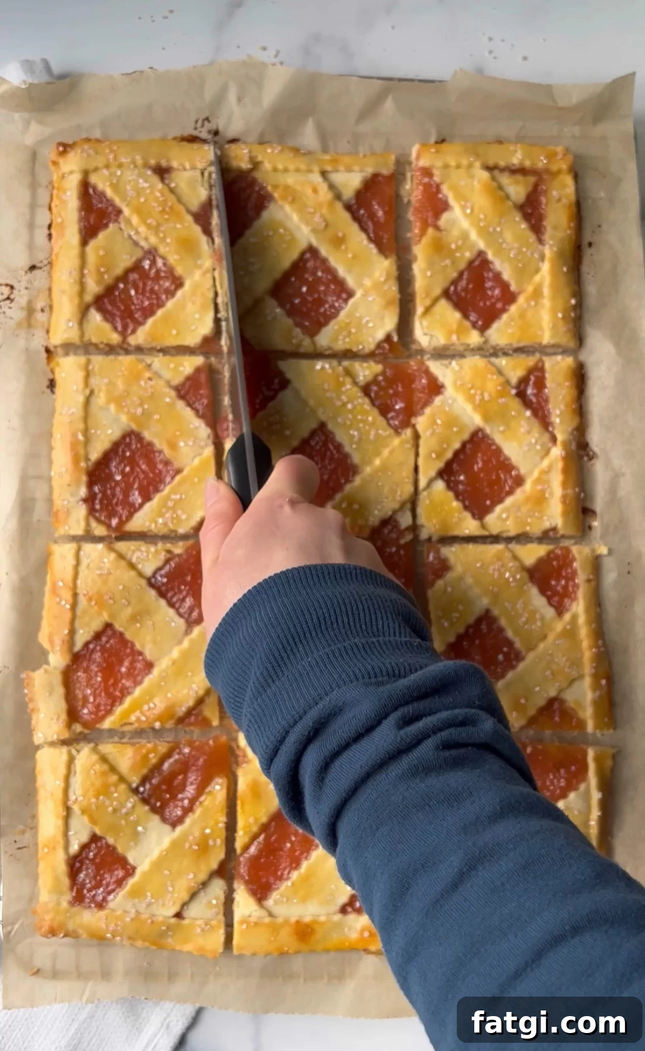 Cutting the rhubarb bars into slices.