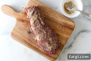 Adding seasoning to a steak.