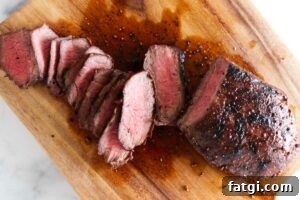 Slicing a steak on a cutting board.