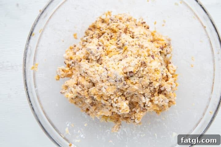 Homemade Cheese Log Recipe 7 cheese log ingredients in a glass bowl.