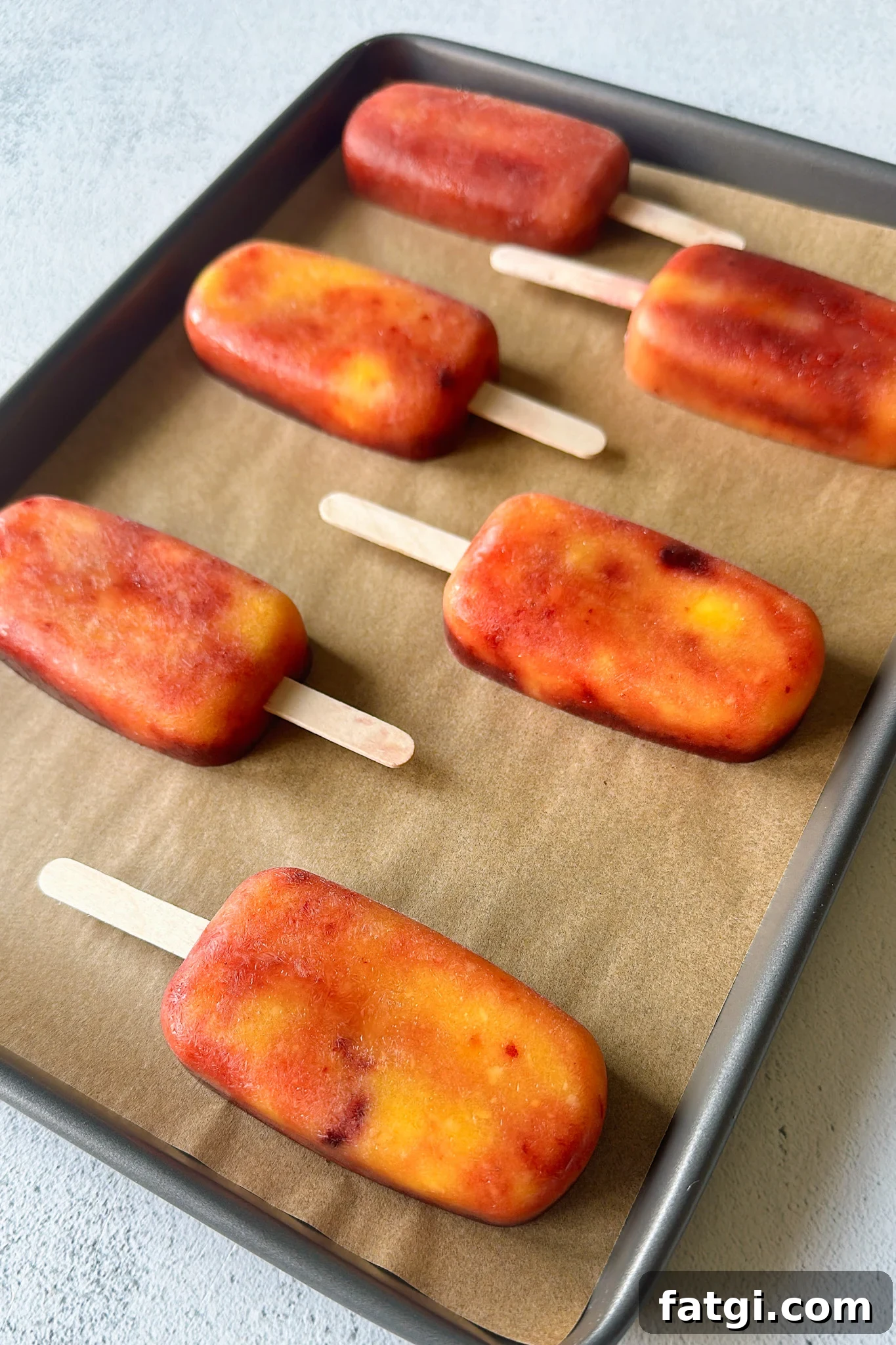 Mango Cherry Popsicles Recipe: Refreshing Homemade Treat 2 Mango cherry popsicles.