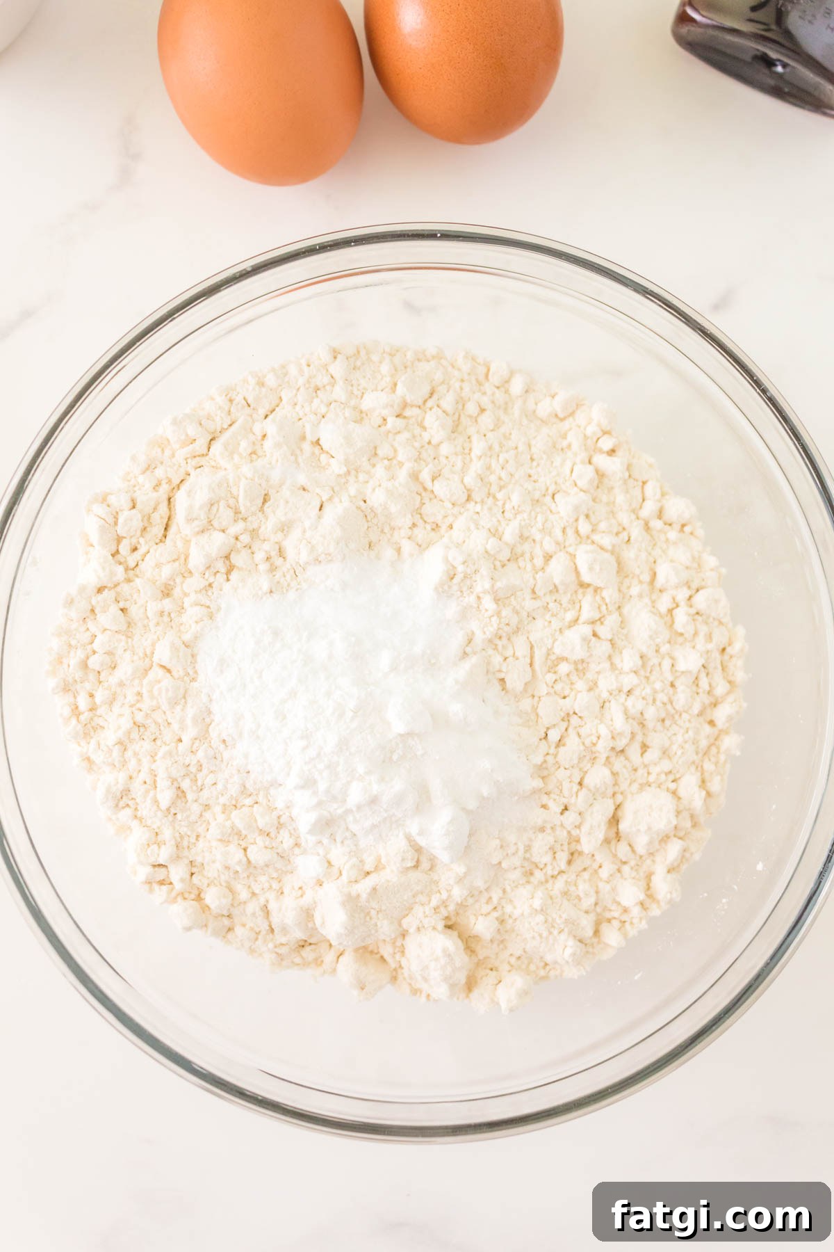 Dry ingredients used for making doughnuts in a bowl