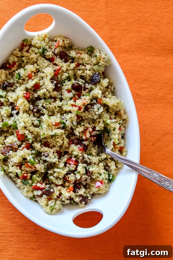 Refreshing Rose Water Quinoa Salad with Citrus & Feta 6 an overview photo of quinoa with finely chopped, colorful vegetables and raisins