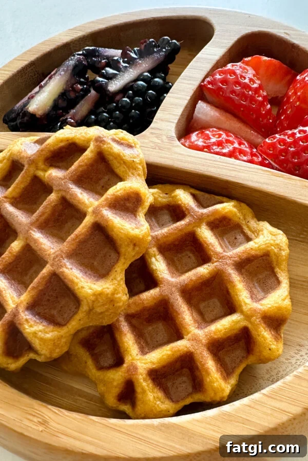 Sweet potato waffles served with strawberries and blackberries.