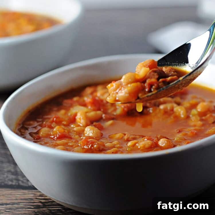 Instant Pot Navy Bean and Smoked Ham Soup 8 spoon of navy bean with ham soup