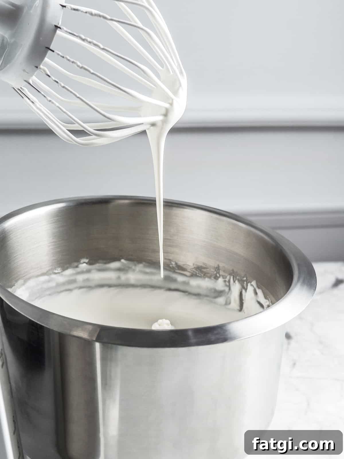 French Chantilly Cream Recipe 4 Chantilly cream with a soft peak at the tip of the whisk