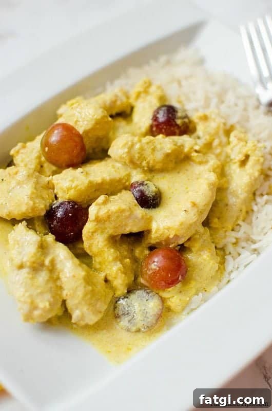 Crockpot Turkey Curry on a white plate with rice