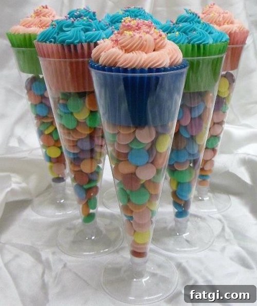 Use plastic champagne glasses from the $1 store and fill them with candy to make cupcake stands! Great idea!