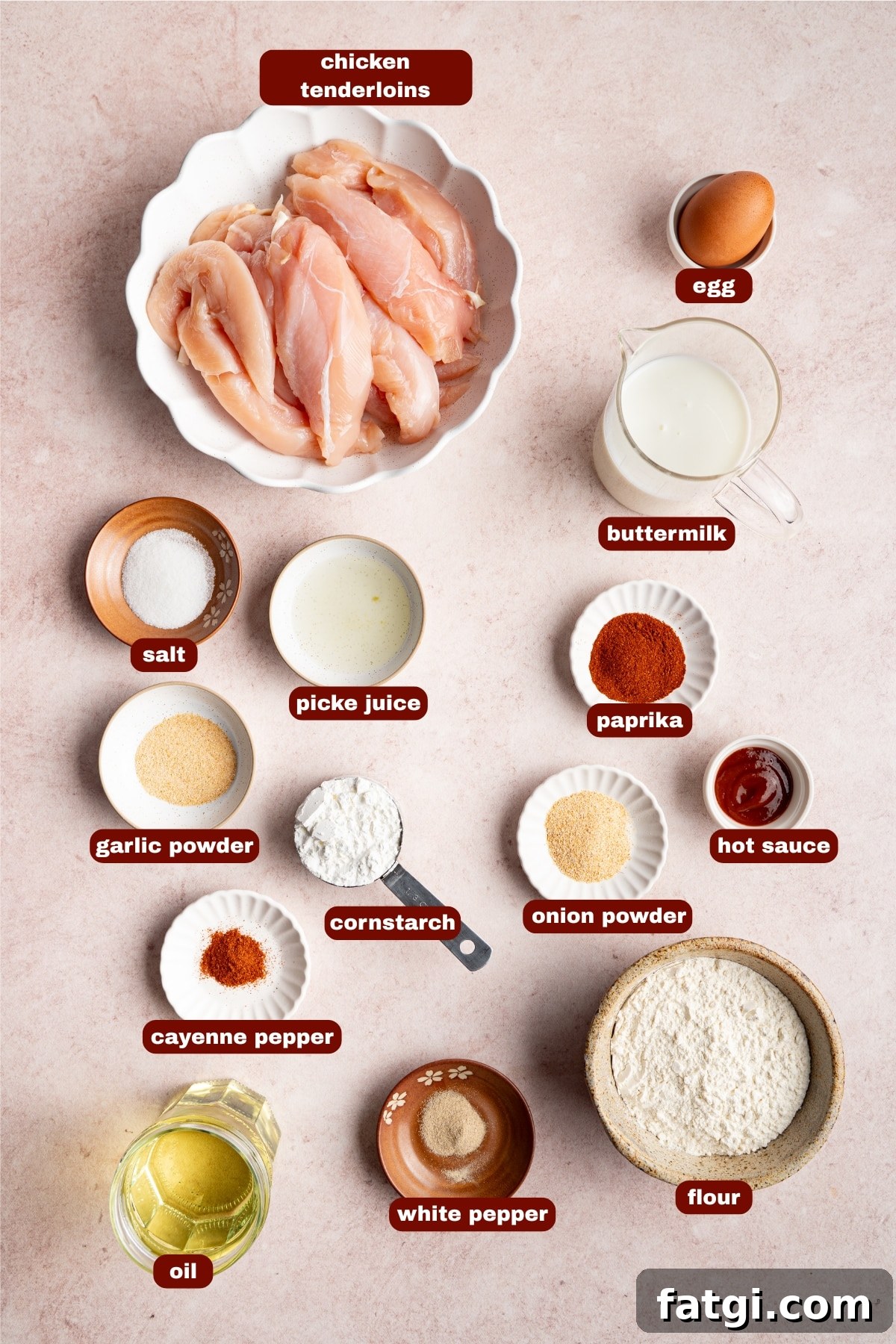Ingredients for Copycat Canes Chicken Tenders seen on a table in small bowls