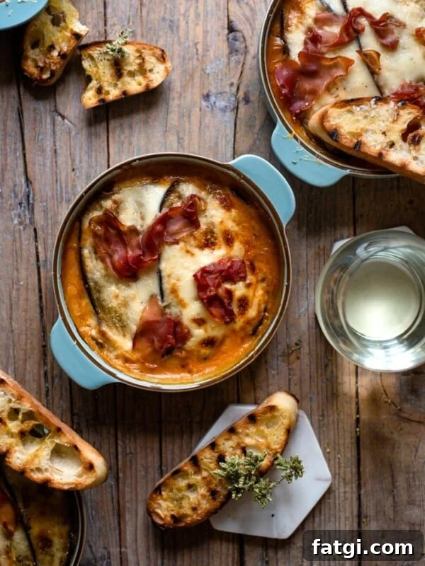 Eggplant lasagna in blue dishes with grilled ciabatta