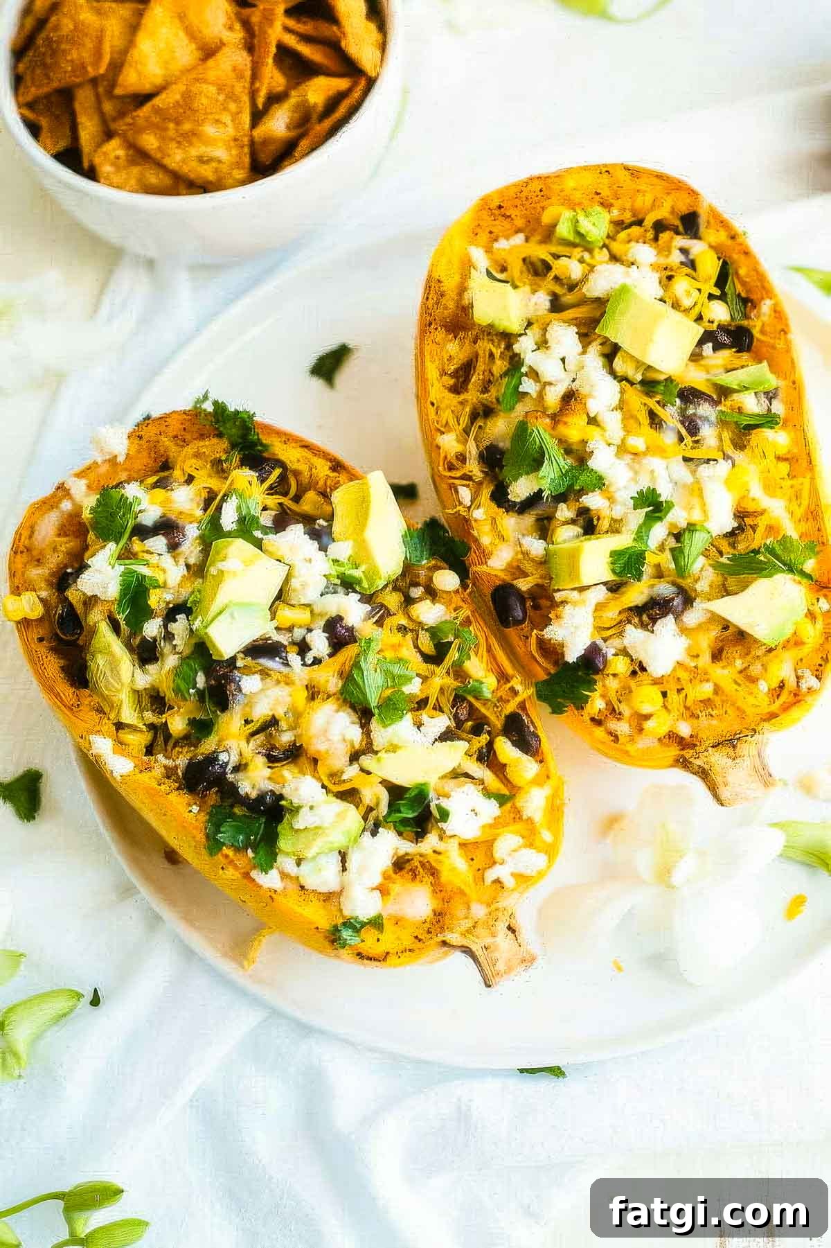 Mexican-Style Spaghetti Squash with Fresh Salsa 2 two mexican spaghetti squash on a white plate