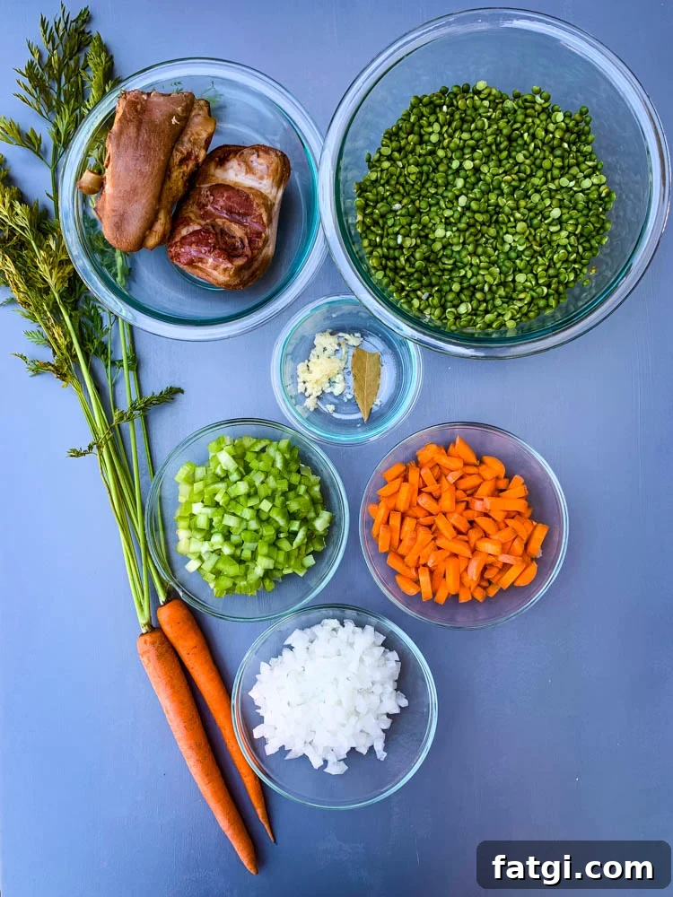 Instant Pot Split Pea Soup Recipe 3 carrots, onions, celery, garlic, split peas, and ham hocks on a flat surface