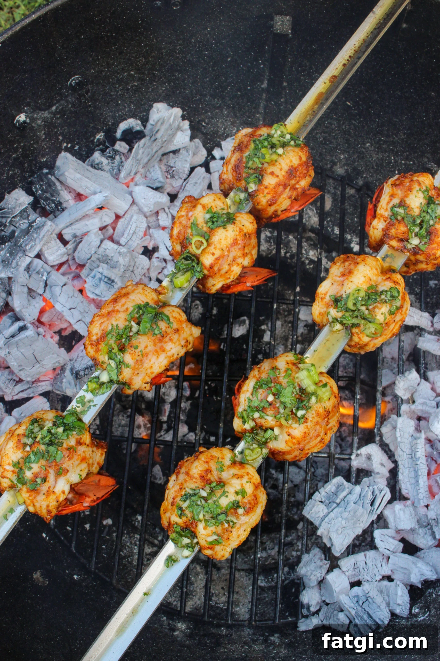 Grilled Lobster Tail Skewers after being basted with butter sauce. 