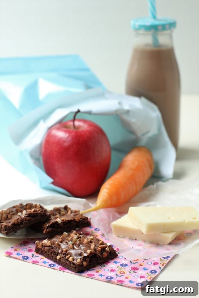 buckwheat brownie brittle in a school lunch bag with apple, carrot, and cheese
