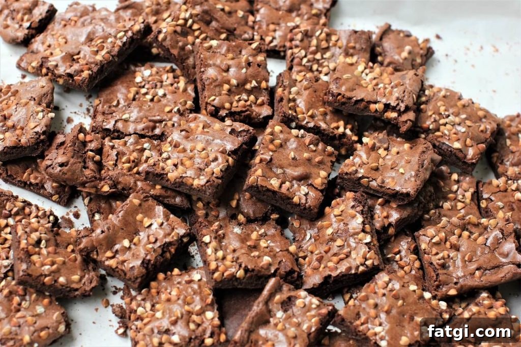 buckwheat brownie brittle; heaps of it in the pan, with buckwheat groats sprinkled on top