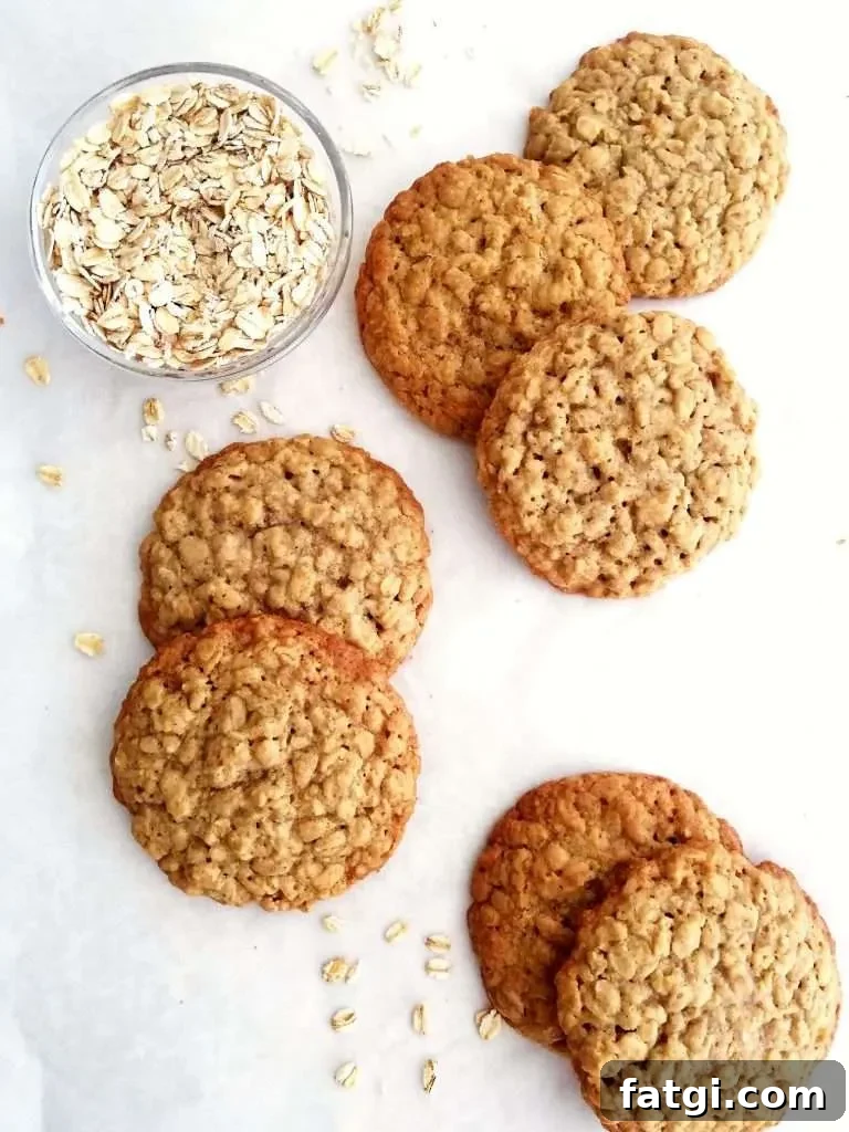 oatmeal cookies scattered on parchment paper overhead image