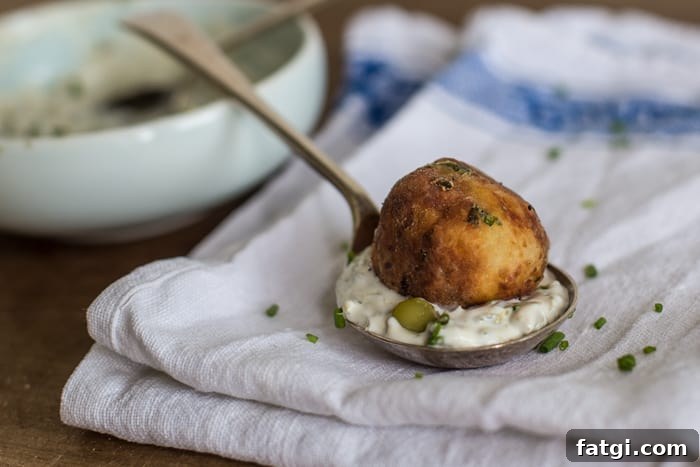 Crispy Fish Balls with Homemade Tartare Sauce 3 Crispy Fish Balls with Easy Tartare Sauce served on a teaspoon on a white cloth