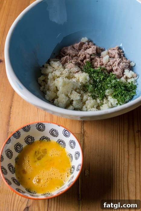 Crispy Fish Balls with Homemade Tartare Sauce 5 ingredients for Crispy Fish Balls with Easy Tartare Suace in a blue bowl beside a patterened bowl of beaten egg