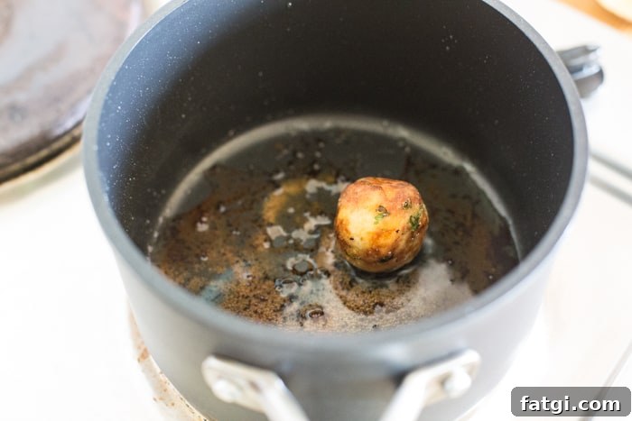 Crispy Fish Balls with Homemade Tartare Sauce 6 Crispy fish Ball shallow frying in a saucepan