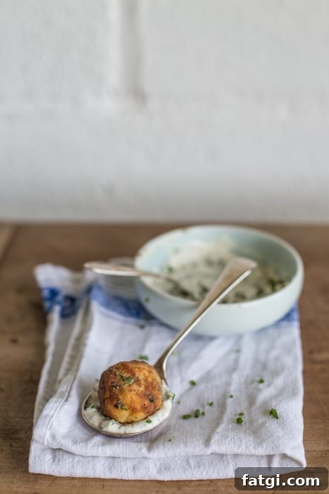 Crispy Fish Balls with Homemade Tartare Sauce 7 Crispy Fish Balls with Easy Tartare Sauce served on a teaspoon on a white cloth